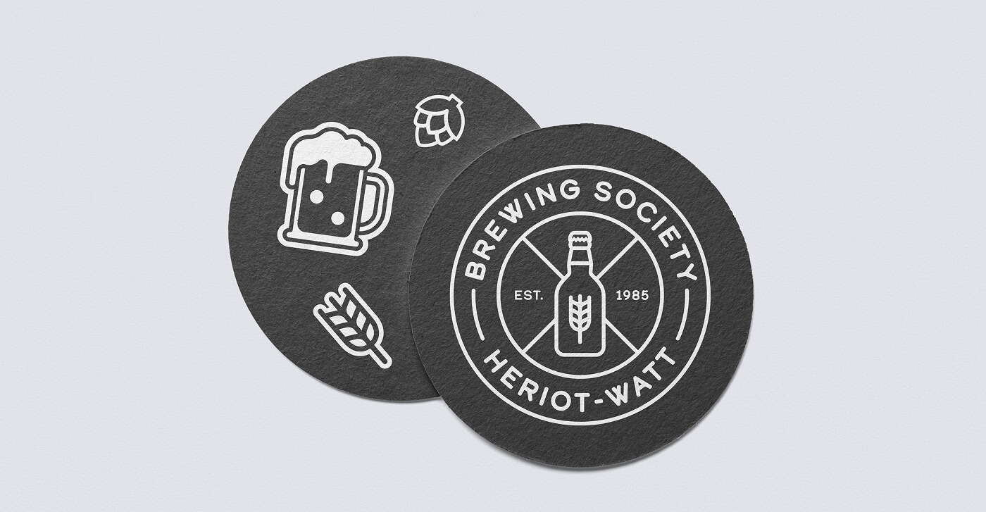 Picture shows 2 coasters with HWBS logo and branding.